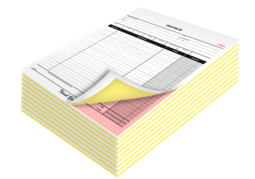 A stack of yellow and pink receipts, showcasing a carbonless bill book printing service in Coimbatore